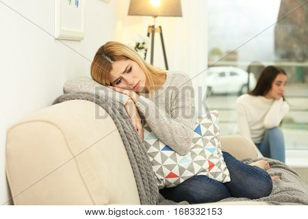 Two quarrelled women in bad mood at home