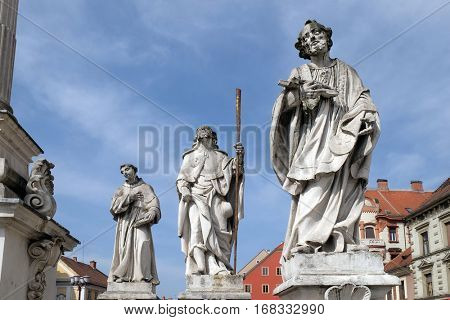 MARIBOR, SLOVENIA - APRIL 03: Saints Anthony of Padua, Roch and Francis Xavier statue, Plague column at Main Square of the city of Maribor in Slovenia, Historical religious sculpture, April 03, 2016.