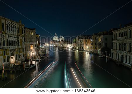 Grand canal in Venice during night  with traces of light from water transport