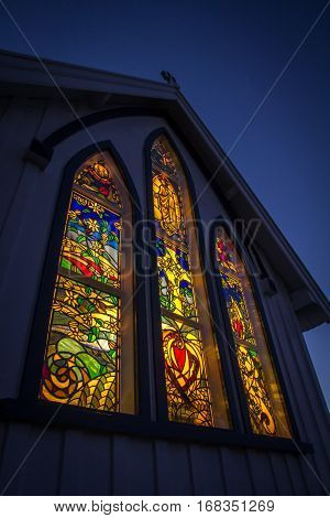 KERIKERI NZ - SEP 5: Stained Glass Windows of the St James Church at Night in Kerikeri New Zealand on Sep 5 2012