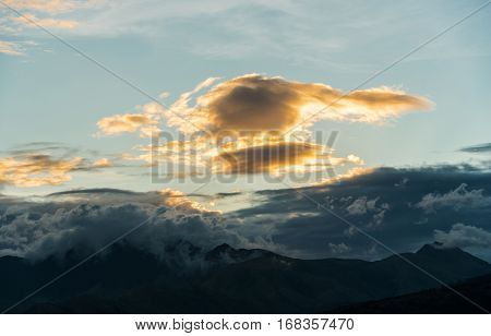 the sun is setting over mountains in Subic bay philippines