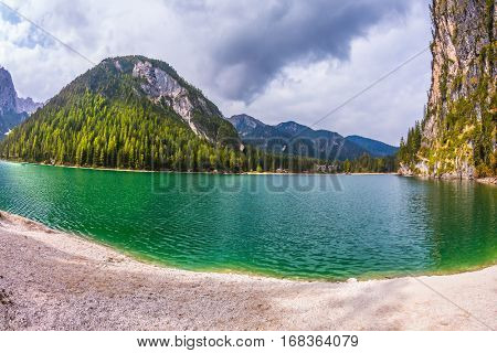  The concept of hiking. Photo taken fisheye lens. Travel to the Southern Tyrol, Italy. Walk around the Alpine lake Lago di Braies