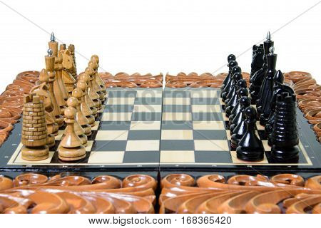 The chess pieces are placed on the chessboard. Defeated black king. The player admitted defeat
