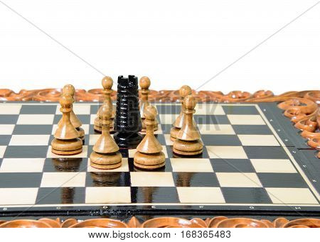 The chess pieces are placed on the chessboard. Defeated black king. The player admitted defeat