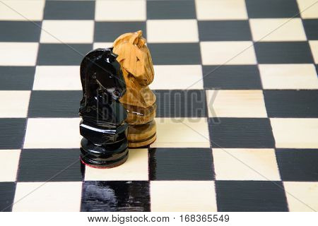The chess pieces are placed on the chessboard. Defeated black king. The player admitted defeat