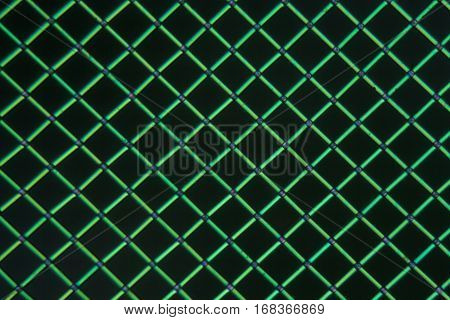 A net of polylactic acid under the microscope and in polarized light. Polylactic acid is a bioactive and biodegradable polymer made of renewable resources.