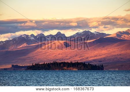 Landscape View Of Lake Tekapo And Mountains At Sunset