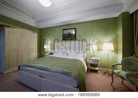 MOSCOW, RUSSIA - NOV 11, 2015: Interior of double room in hotel Radisson Royal Ukraine, one of the seven Stalin skyscrapers.