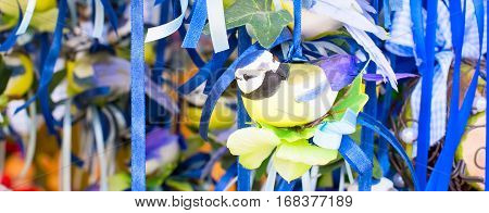 Easter decorative bird figurines at traditional European market banner nackground