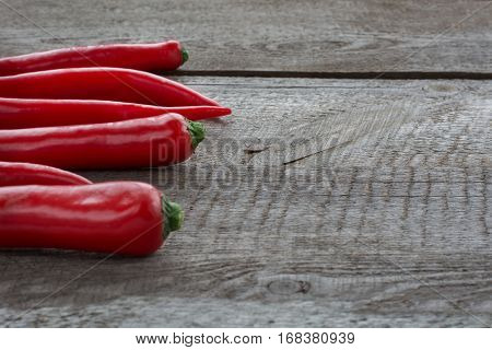 Red Hot Chili Peppers on vintage wooden board. Soft focus and backlight.