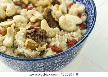 Healthy Oatmeal Porridge With Goji Berries, Cashew, Walnuts