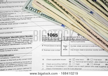 Tax forms 1065 with dollar close up