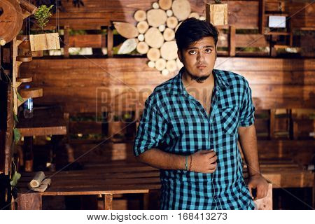 Handsome fashion man wearing shirt Posing in woods