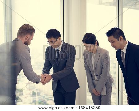 Business Partners Introductionary Handshake Bow