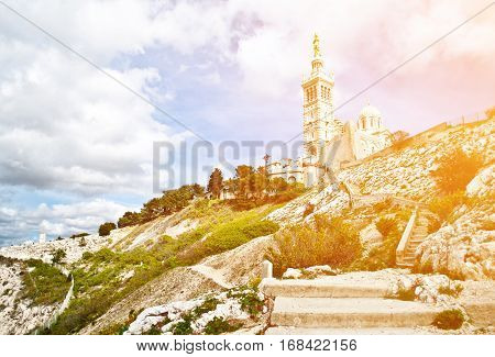 Notre-Dame de la Garde (literally Our Lady of the Guard) is a basilica in Marseille France. This ornate Neo-Byzantine church is situated at the highest natural point in Marseille.