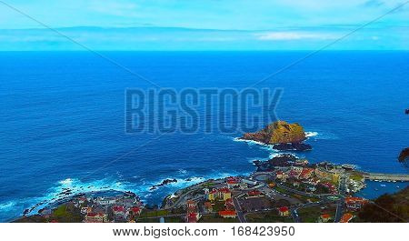 View of the village of Porto Moniz with lava-rock pool Madeira Island Portugal