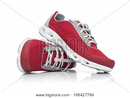 Unbranded modern sneakers isolated on a white background. Red sneakers.