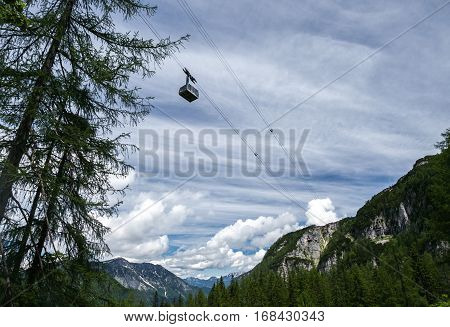 Cableway in the mountains. The connection between heaven and earth.