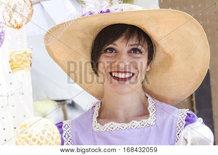 CAGLIARI, ITALY - May 29, 2016: Sunday at La Grande Jatte VIII Ed. At the Public Gardens - Sardinia - portrait of a beautiful woman in Victorian costumes