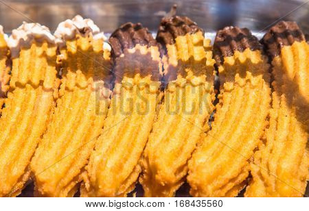 closeup on fresh spanish churros in a shop