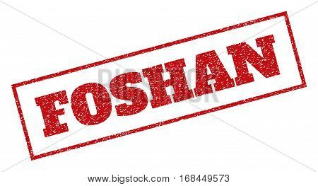 Red rubber seal stamp with Foshan text. Vector tag inside rectangular frame. Grunge design and scratched texture for watermark labels. Inclined sticker.