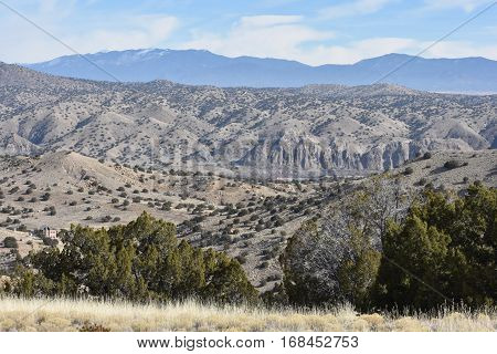 Landscape view of rural off grid cottage in high desert NM mountains