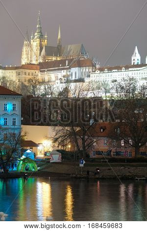 Prague, Czechia - November, 21, 2016: Panorama of an old Prague, bridges and embankment of Vitava river, Czechia in a night