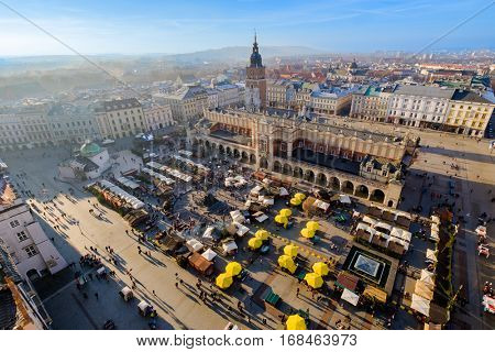Day time aerial sityscape of central square with Christmas fair in Krakow old city, Poland