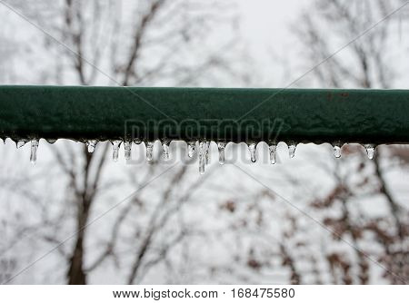 Icicles on a rail on a cold winter morning