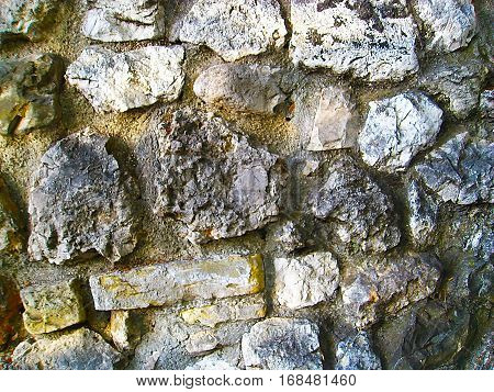 A large stone masonry old wall texture background