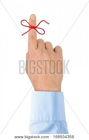 Red bow on finger isolated on white background