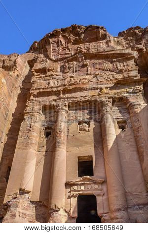 Rose Rock Royal Tomb Arch Petra Jordan. Built by the Nabataens in 200 BC to 400 AD. Rose Red canyon walls create many abstracts close up. Inside the Tombs the rose red can become blood red. Reds are created by magnesium in sandstone.