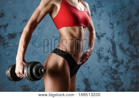 Muscular fitness woman, healthy lifestyle, Cross fit bodybuilder, athletic woman's body, close up of young woman with barbell flexing muscles