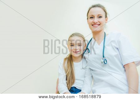 Happy Little Hospital Patient with Her Female Medical Doctor.
