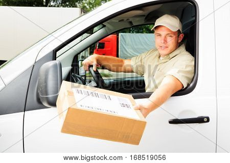 delivery boy handing you a parcel. all barcodes on the parcel are generated by myself and contain no useful data.