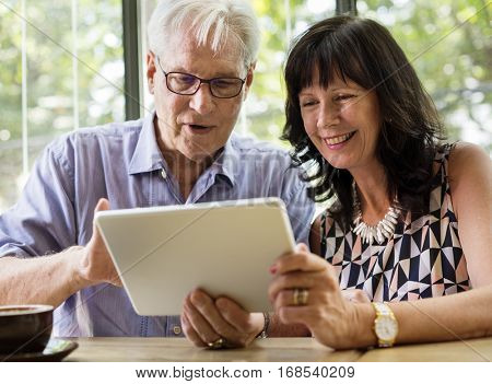 Couple using tablet browsing together