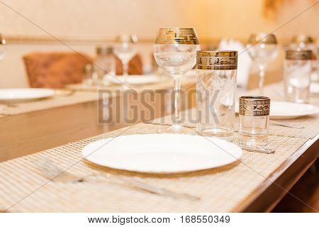 Wine glasses on a table glasses on a table. Beautiful interior magnificent table. The buffet table
