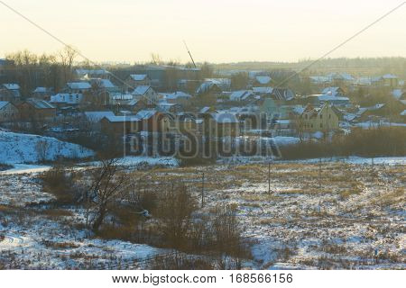 beautiful winter landscape. cottages in a sunlight