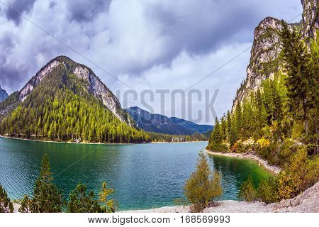 Travel to the Southern Tyrol, Italy. The concept of hiking. Photo taken fisheye lens. Walk around the Alpine lake Lago di Braies