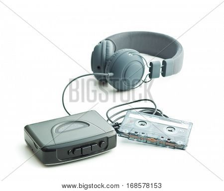 The vintage audio player and headphones isolated on white background.