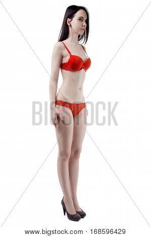 Half turned woman in lingerie on white background