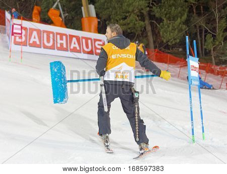 STOCKHOLM SWEDEN - JAN 31 2017: Official with a spade in the parallel slalom event in the parallel slalom event at the Alpine Audi FIS Ski World Cup - city event January 31 2017 Stockholm Sweden