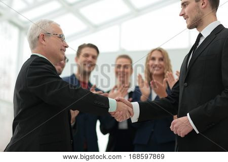 Success concept in business - handshake of business partners
