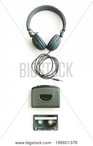 Vintage audio player, audio tape and headphones isolated on white background.