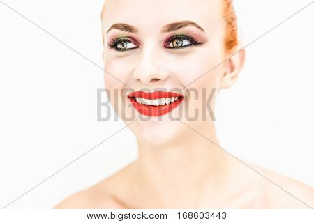 Close-up. Portrait of a woman with red lips and closed eyes on a light background
