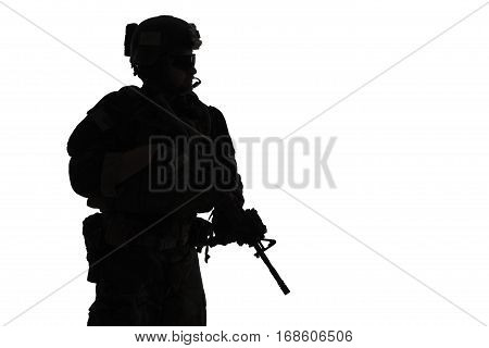 United states Marine Corps special operations command Marsoc raider with weapon. Silhouette of of Marine Special Operator white background