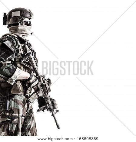 United states Marine Corps special operations command Marsoc raider with weapon. Studio shot of Marine Special Operator white background copyspace