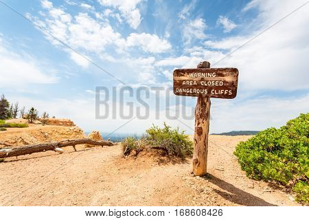 Warning sign in mountains valley.