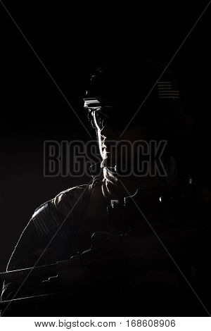 United states Marine Corps special operations command Marsoc raider. Contour backlit studio shot of Marine Special Operator black background