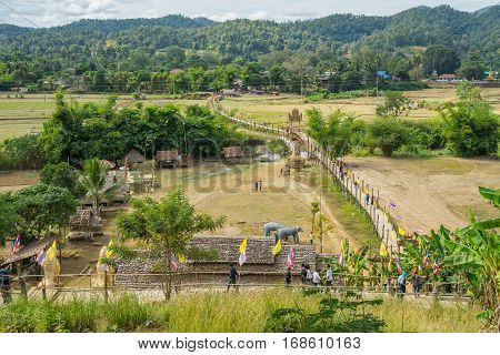 Mae Hong Son, Thailand - JAN 2, 2017: Many people walking on a bamboo bridge ( Su Tong Pe bridge) in Mae Hong Son province Thailand.